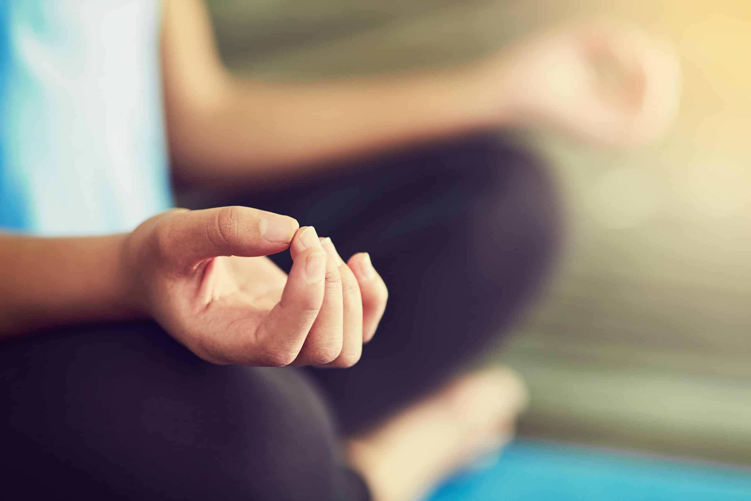 acupuncture for asthma — person sitting calmly practising relaxed breathing